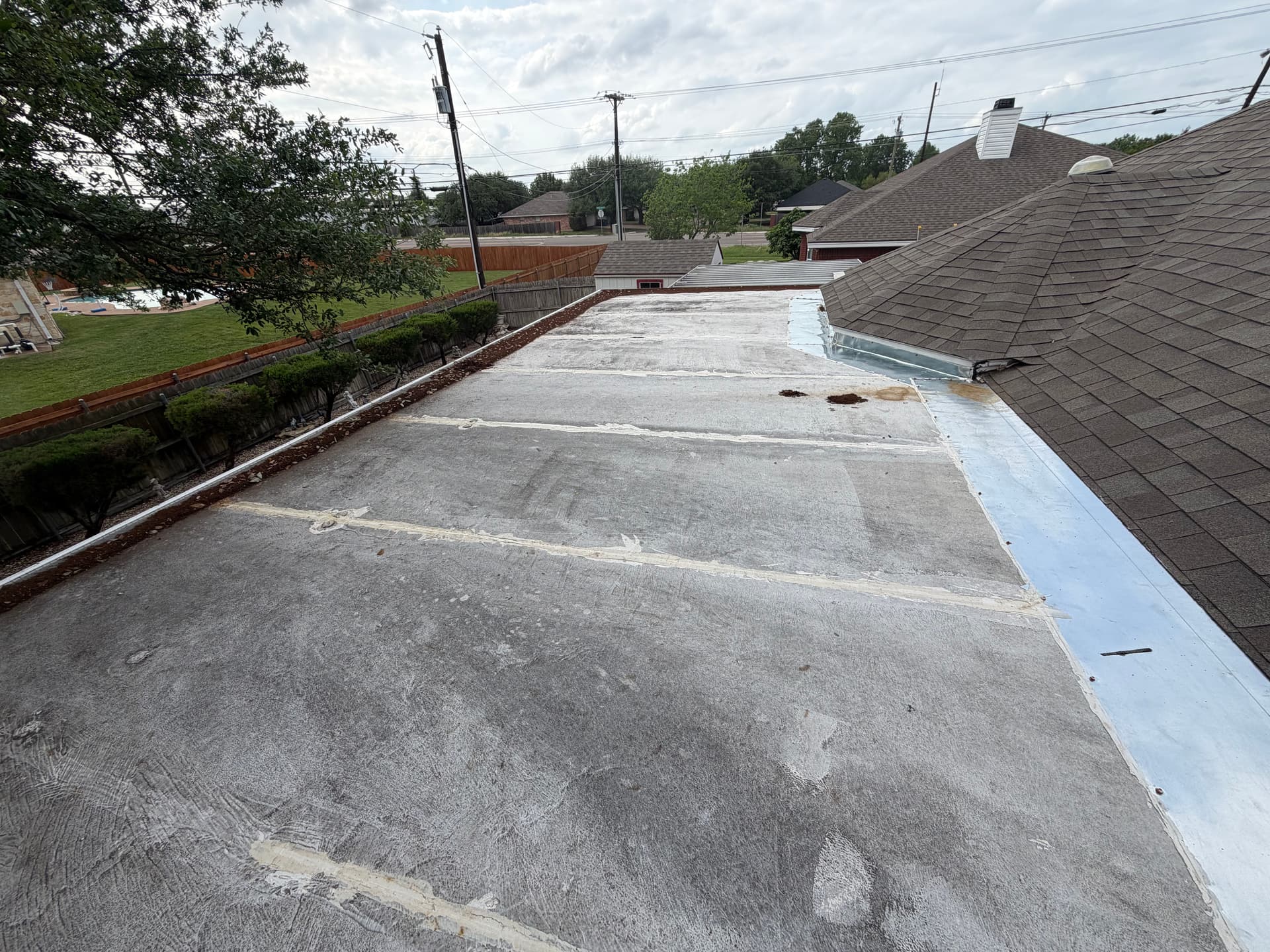 Silicone Roof Coating Stops a Leaking Flat Roof Cold image